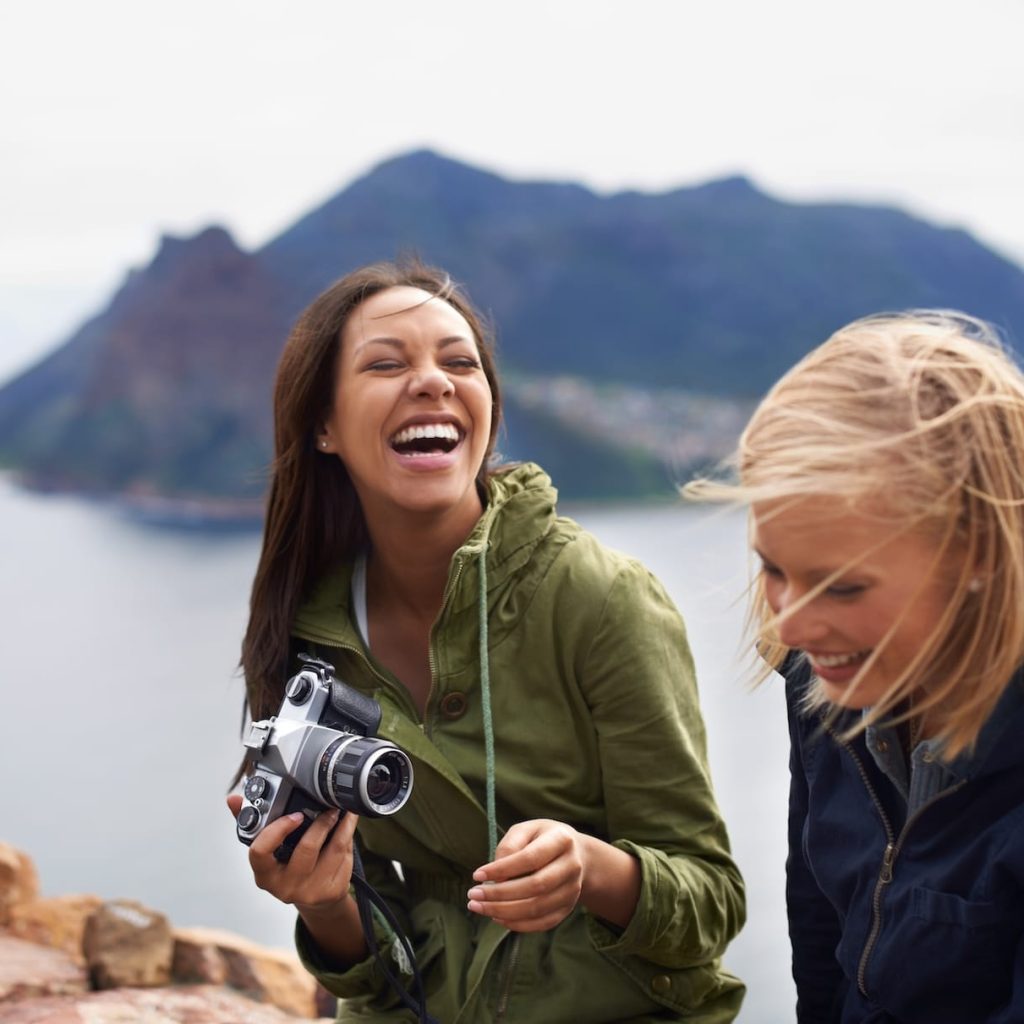 a-shot-of-two-young-women-laughing-on-the-side-of-2025-04-06-11-57-08-utc